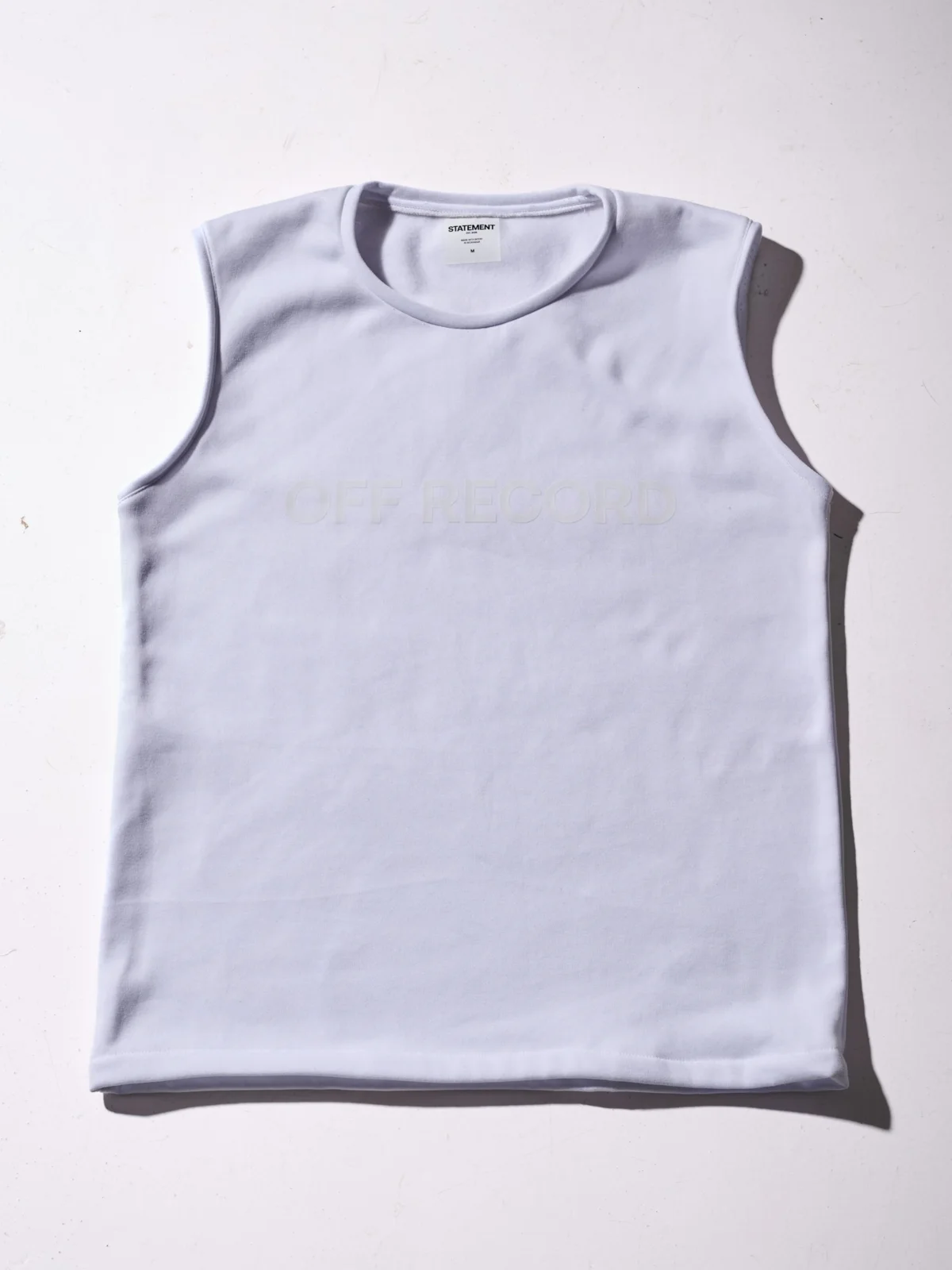 boxy off-white sleeveless t-shirt